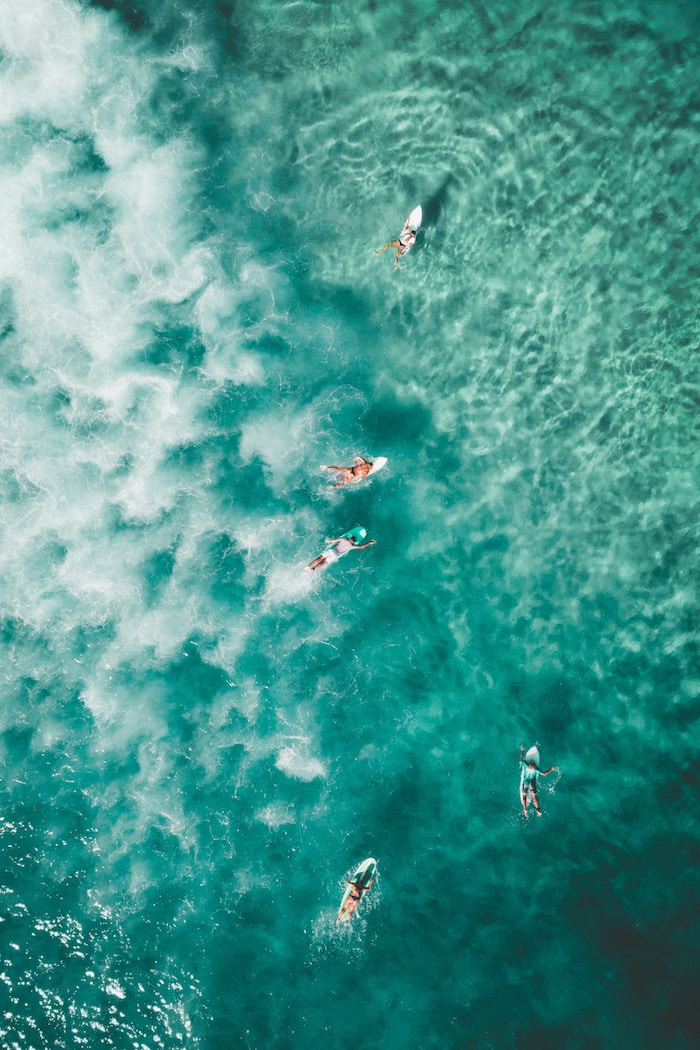 Surfer in turquoise water